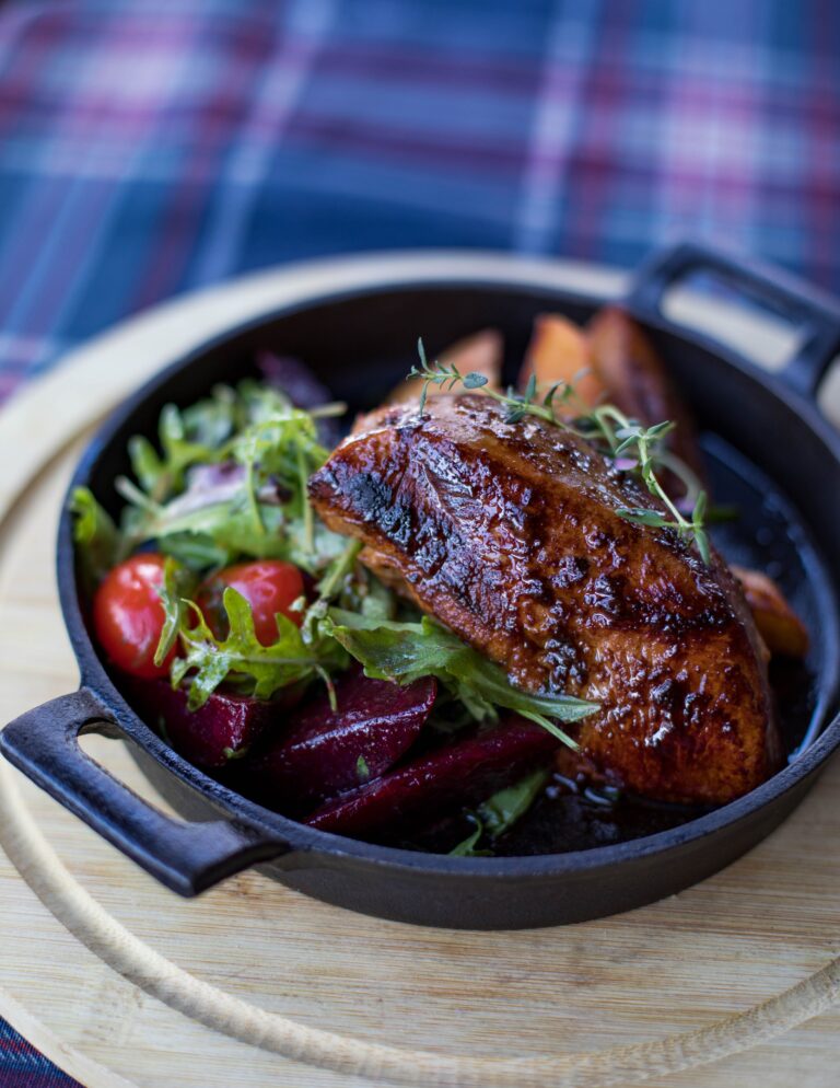 Grilled quality meat served with fresh salad and vegetables, an example of nutrient-dense animal protein
